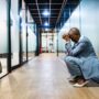 Worried businesswoman at corridor office