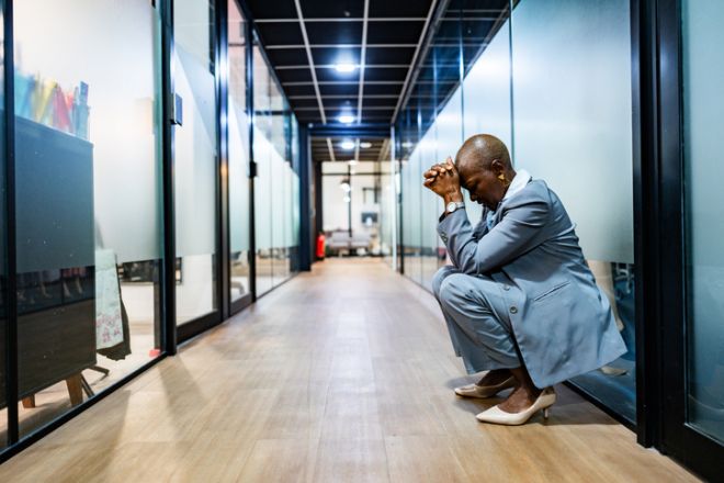 Worried businesswoman at corridor office